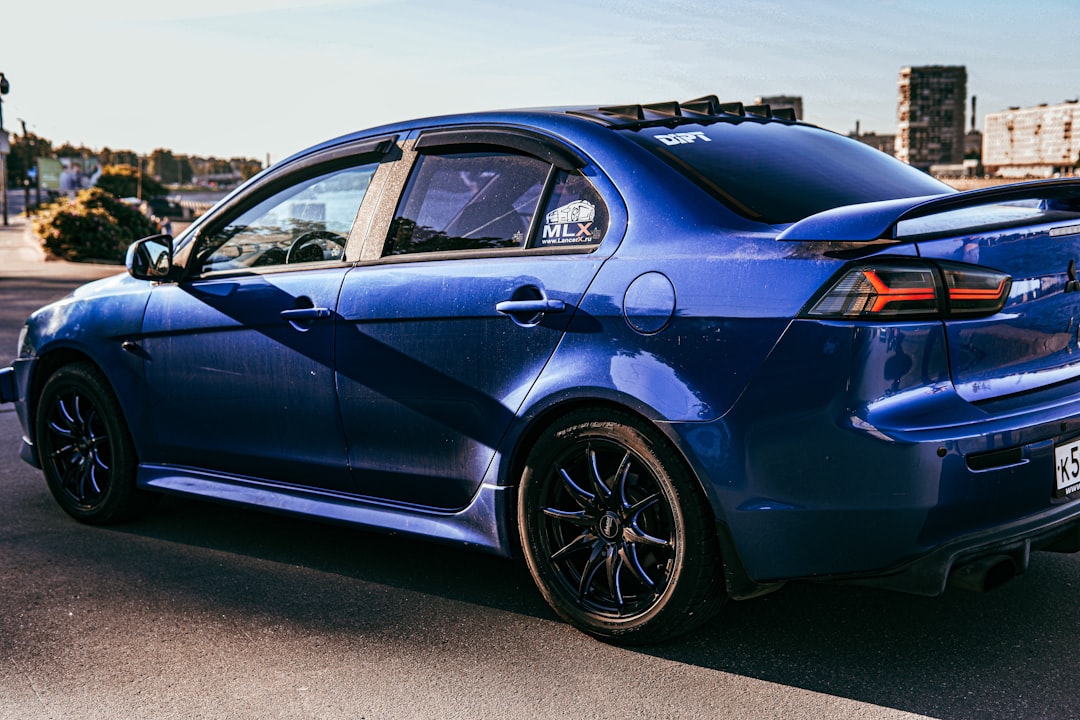 Blue Porsche 911 on the road